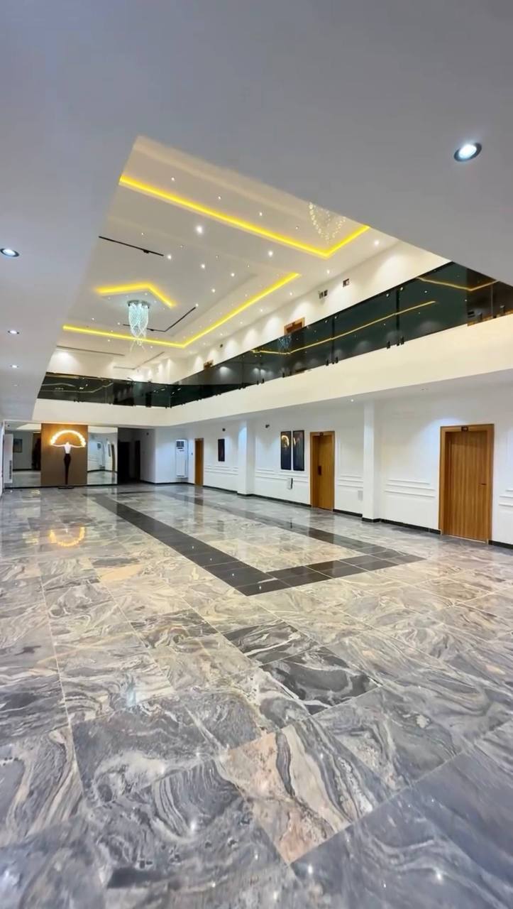 The double-height marble atrium at GAIA HOTELS & SUITES